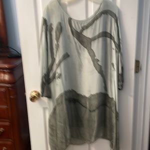 Versatile flowing blouse. May be worn straight or tied to the side